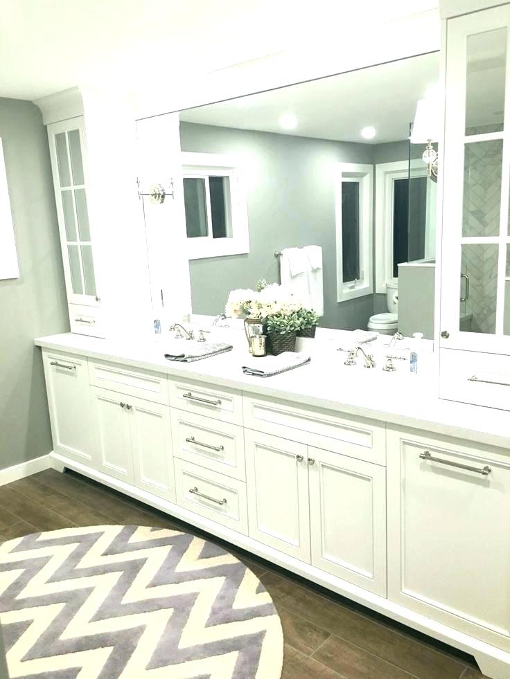 Featured image of post White Double Sink Bathroom Ideas - Sleek white cabinetry creates a solid double sink console.